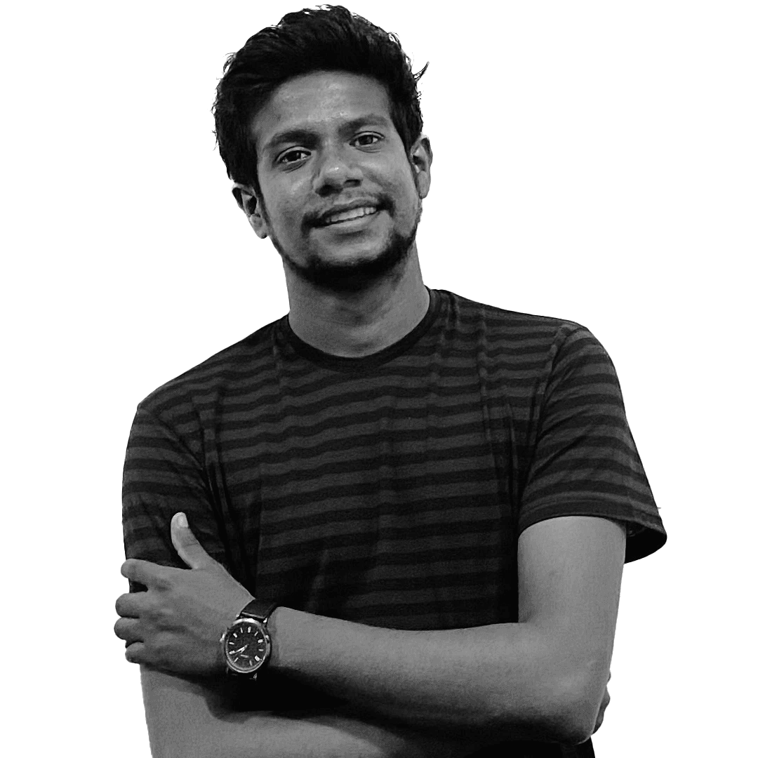 Vathsan Sharma, arms folded, smiling